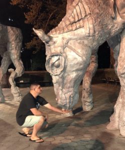 Patrick Zeinert pretends to feed "The Horses" sculpture in Central Park. Jean-Marie Appriou was commissioned by the Public Art Fund for this installation from September 11, 2019 to August 30, 2020.